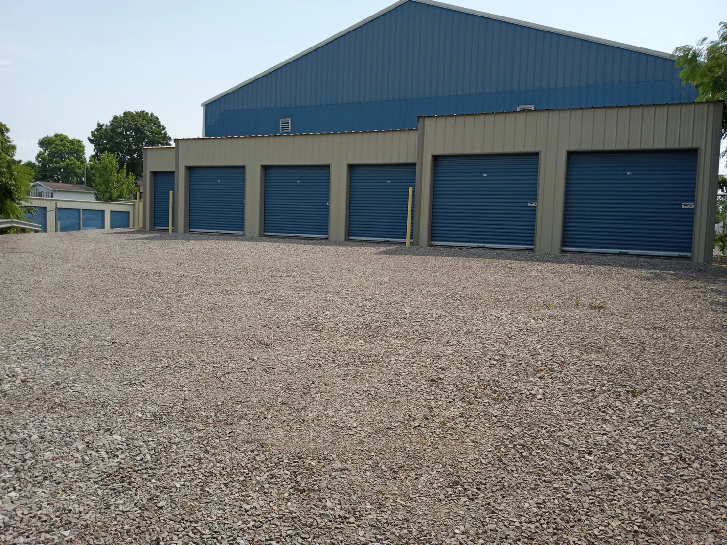 A large storage unit featuring two garage doors, designed for easy access and ample storage space A large storage unit featuring two garage doors, designed for easy access and ample storage space