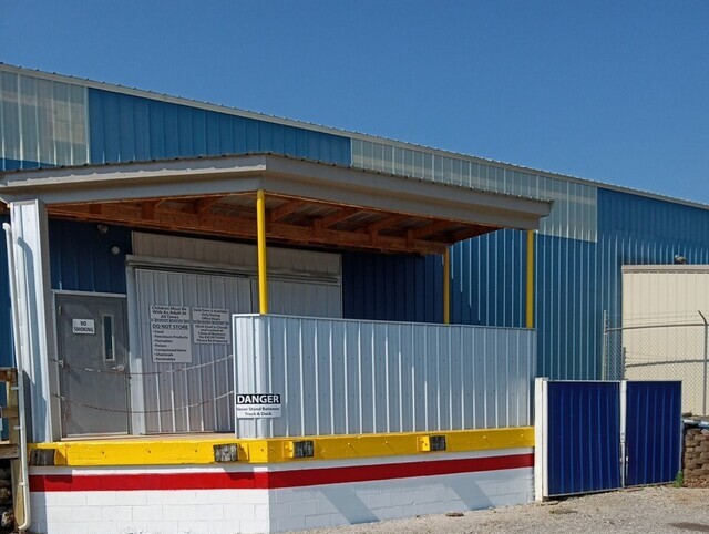 fec190c4c87844888b67431a48ca28f9 (1) Exterior of an Industrial Building in Sunlight
